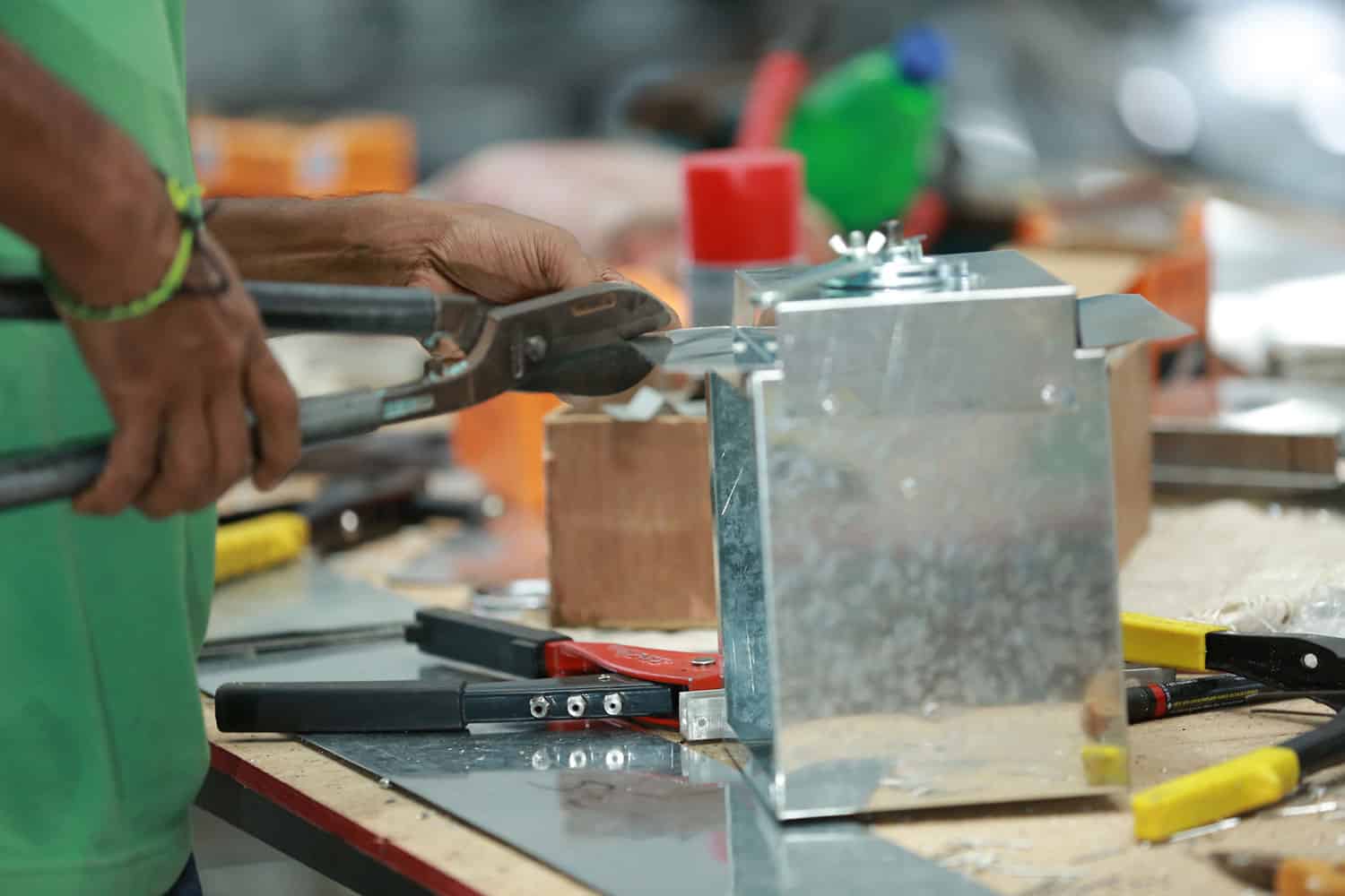 A man working on a work bench with tools